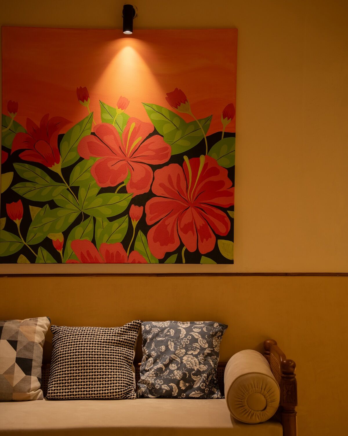 A hand-painted floral mural above the seating in bedroom one.